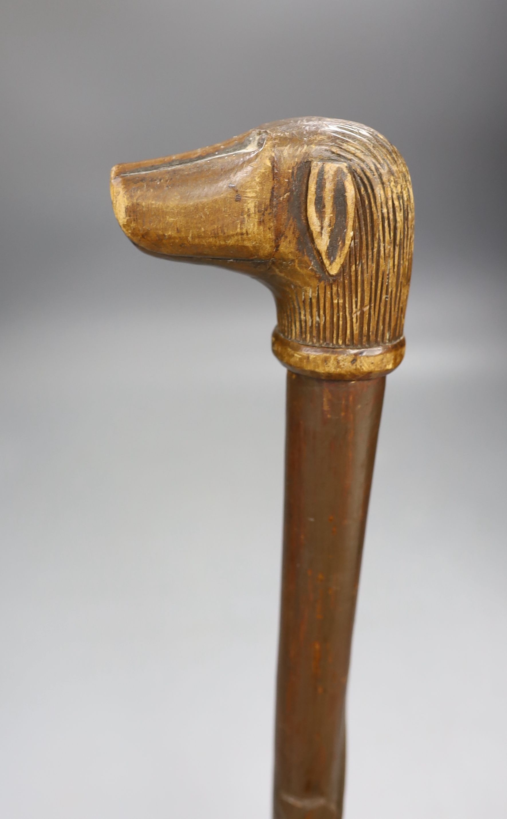 A Folk art carved dog-head walking cane - 92.5cm